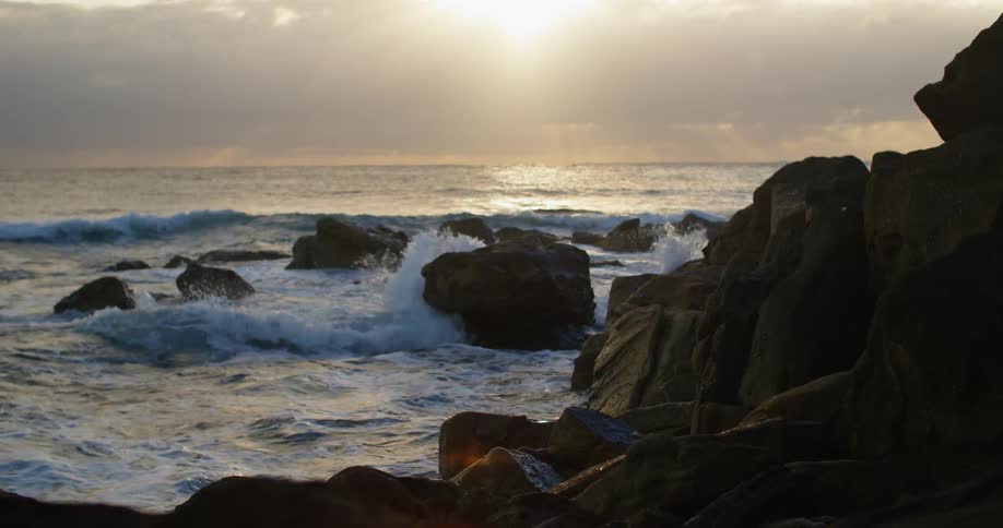 A view of waves crashing against a beach