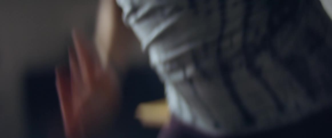 A black female running fast in place in a room