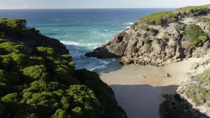 Aerial view of a small cove in the coast at daytime