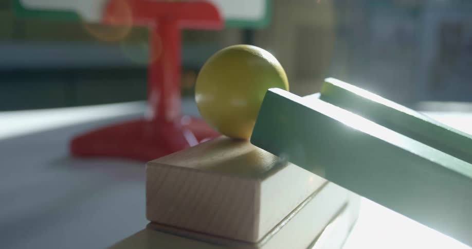 Wooden blocks on a table with a wall in the background