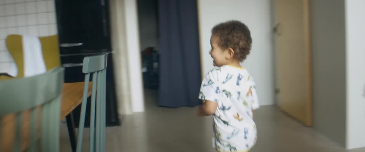 Father playing with his son and daughter on the kitchen at home