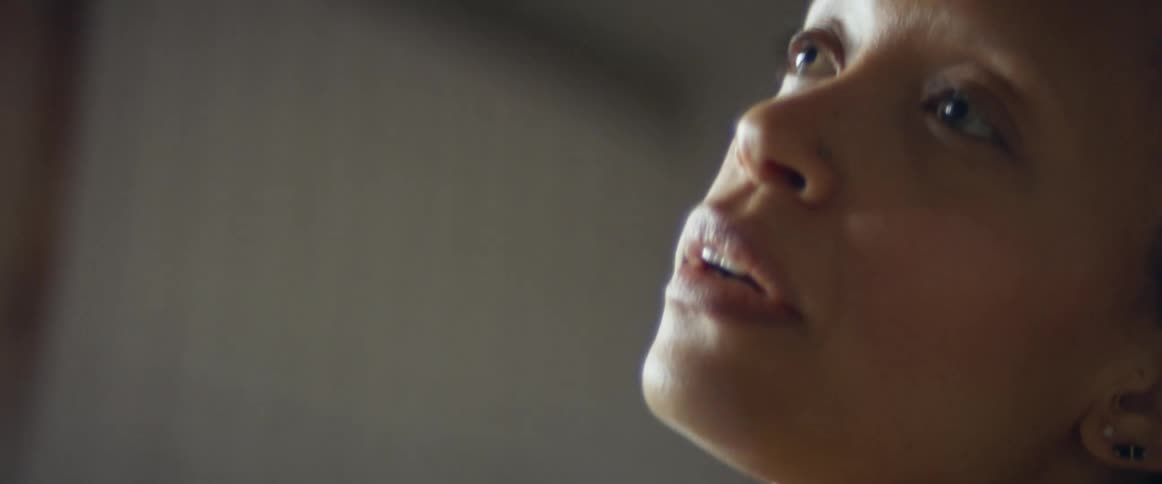 A woman breathing heavily during a workout