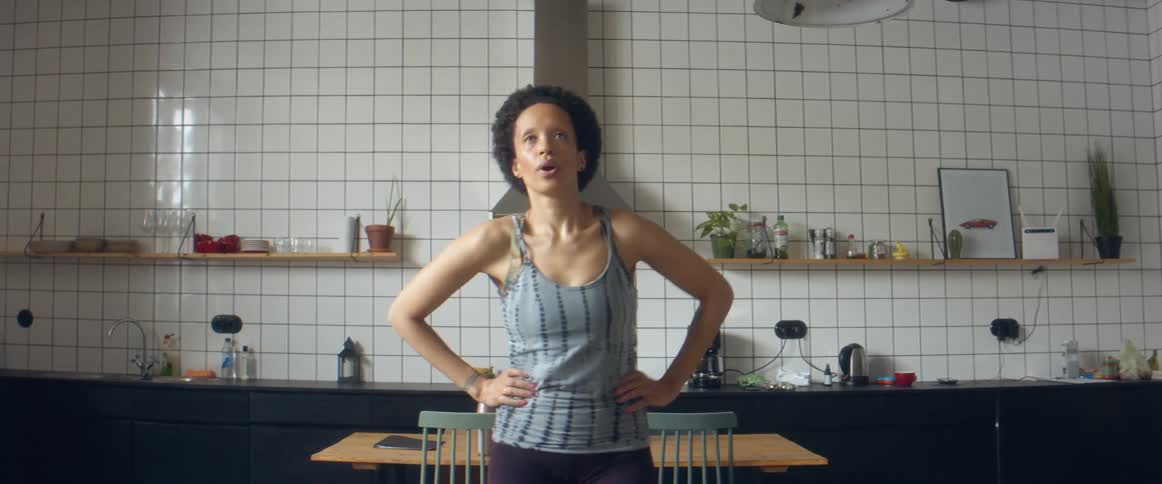 Woman stretches after a session of workout fitness at home
