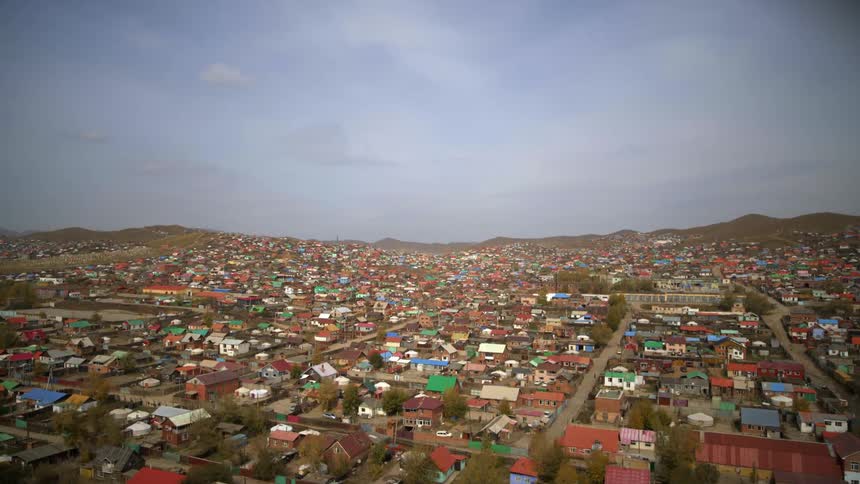 An aerial view of homes and buildings in a town