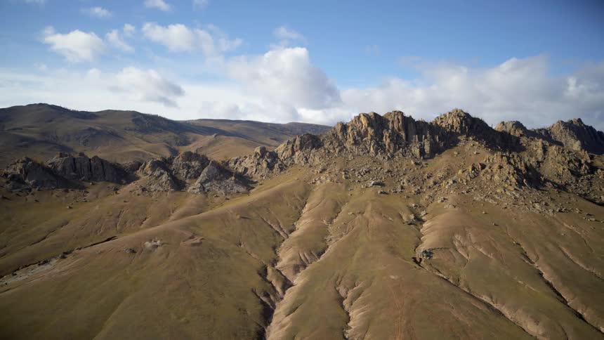 An aerial view of a mountain range in nature