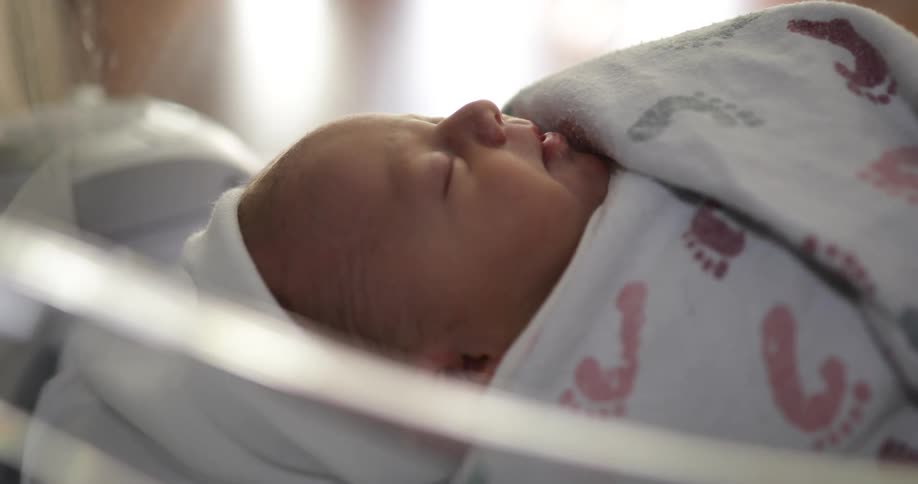 A baby sleeping in a nursery