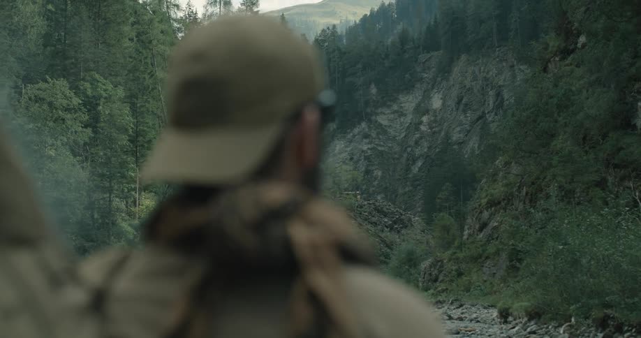 A soldier standing in the wilderness