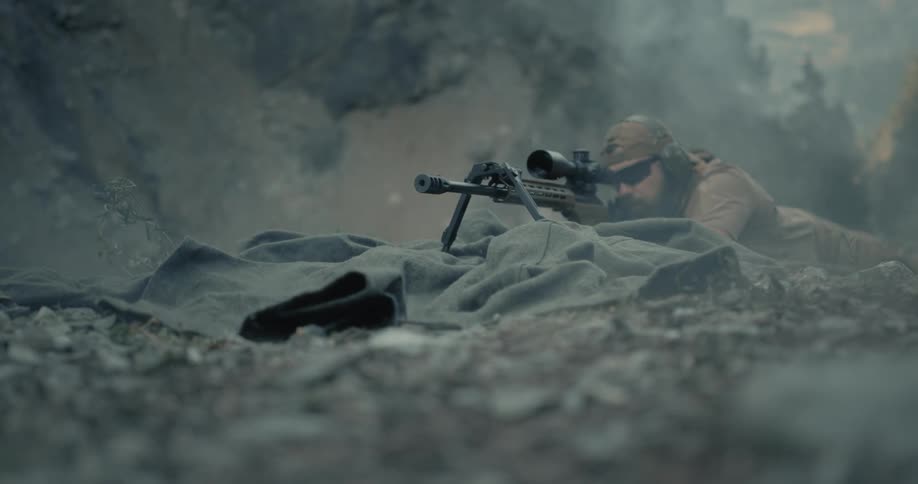 A man shooting a sniper rifle