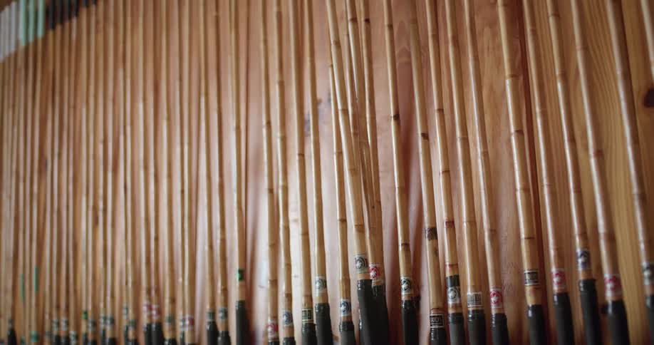 A view of sticks that make up an art piece on a wall