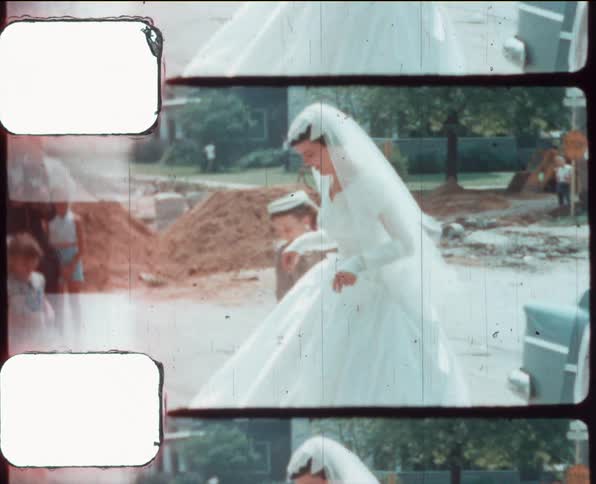 Bride arriving at a wedding caught on vintage film