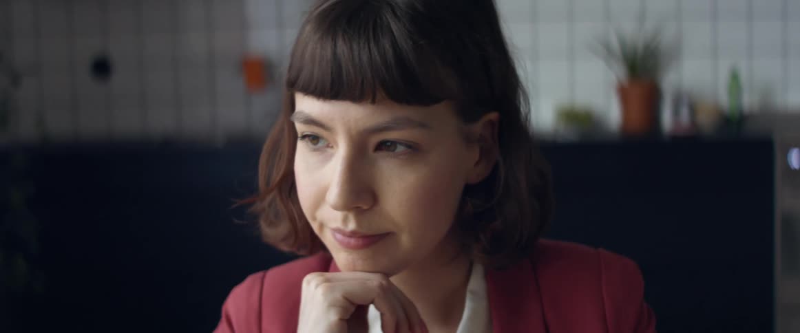 A woman talking in a room