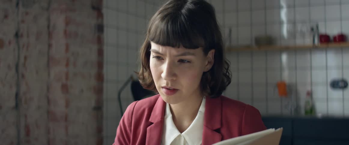 A woman that is reading things in a book