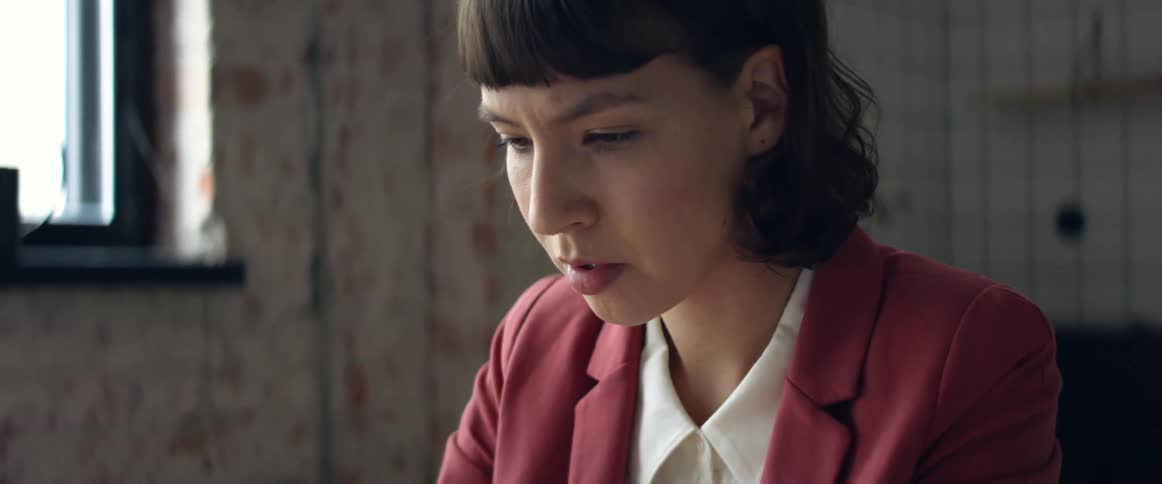A woman reading something in front of her