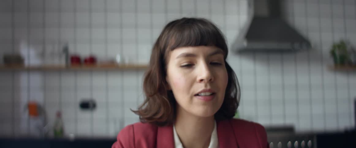 Woman talking to friends on a video call from home