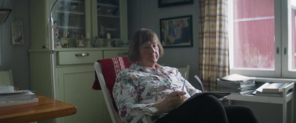 Woman sitting on the living room at home looking bored while reading