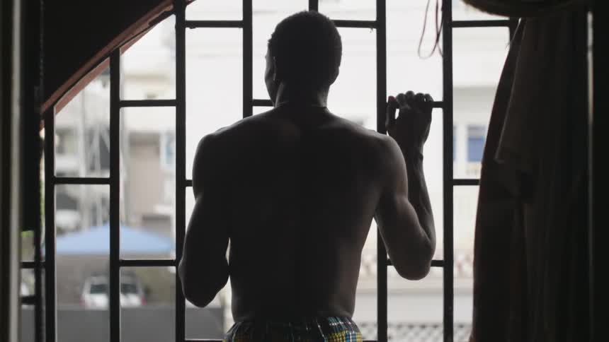 A man staring out of a window