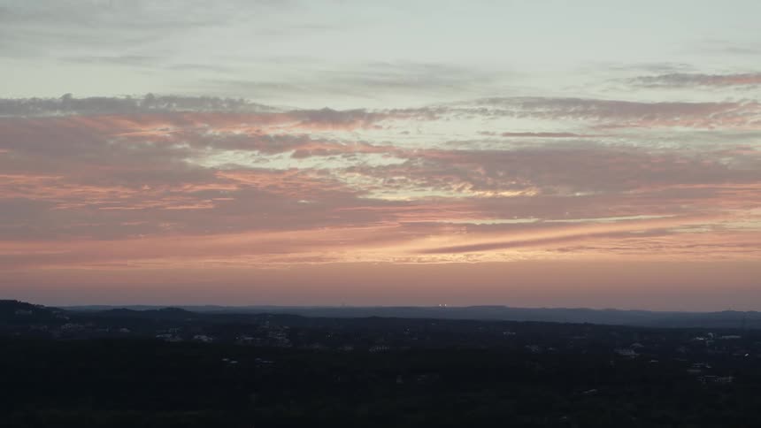 A landscape with hills with the sky and clouds in the background