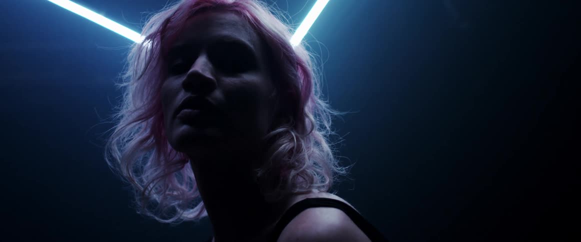 A portrait of a woman in a dark room
