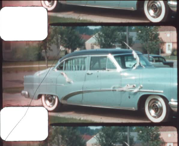 Vintage car decorated for a wedding parked in the garage of a house caught on vintage film