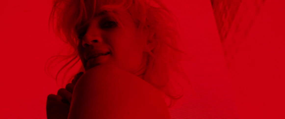 A portrait of a woman in a red room