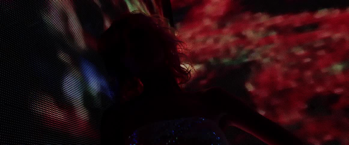 A woman standing in a club
