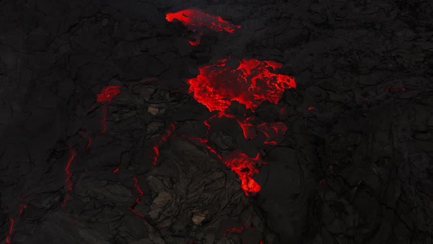 River of molten hot lava glows in the darkness