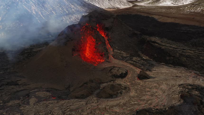 An aerial view of a volcano erupting
