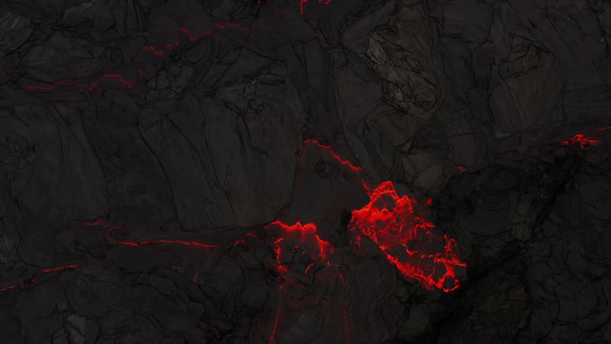 Lava flowing as a volcano erupts