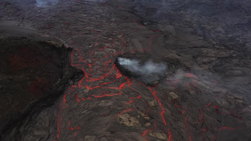 The ground with molten lava smoke and rocks