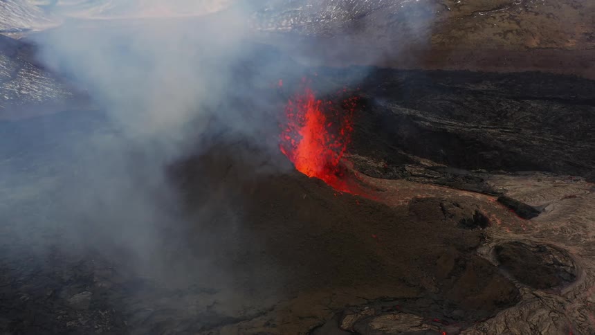 Lava spews as a volcano erupts