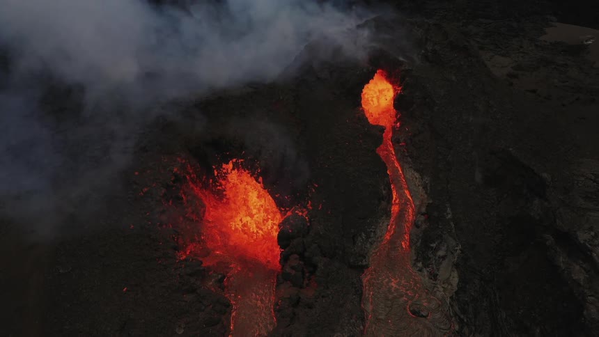 Lava flowing as a volcano erupts