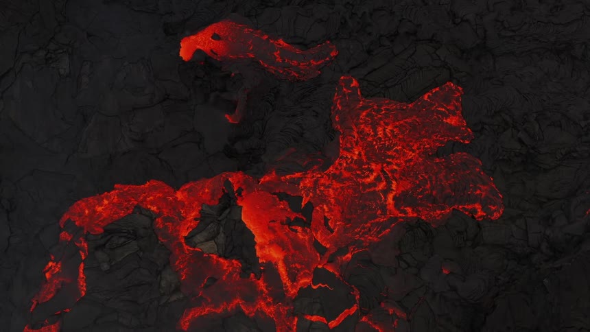 A view of lava flowing down a mountain