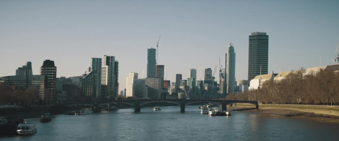 A view of a city skyline next to a river