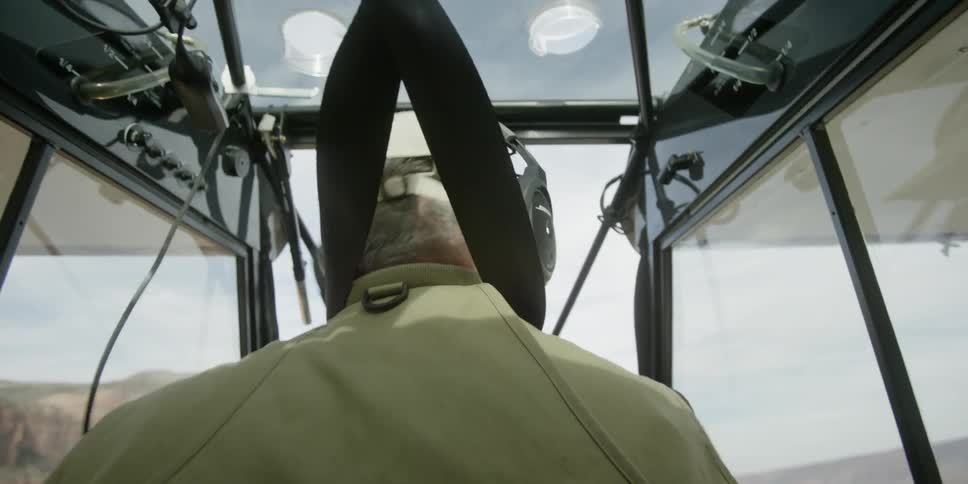 A man is sitting in a plane