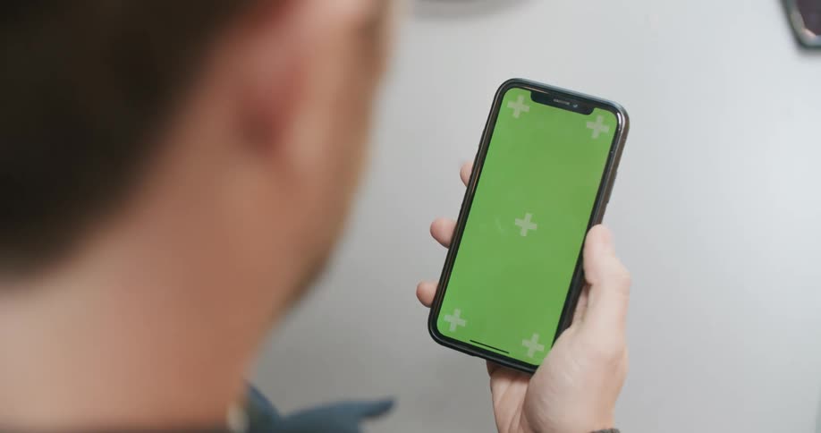 A man scrolling on a smart phone screen