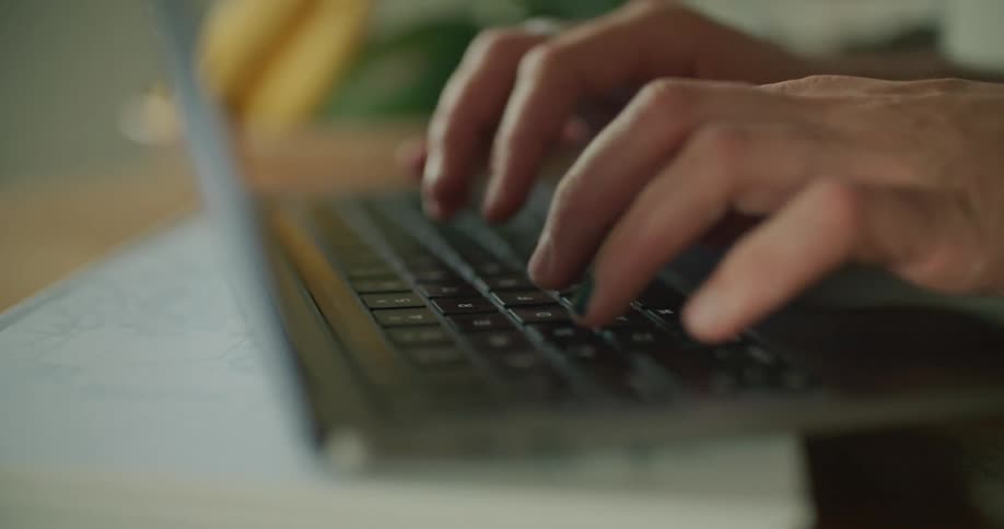 Somebody is typing on a laptop keyboard