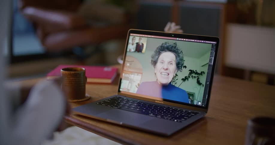 A person is video chatting with a person via laptop