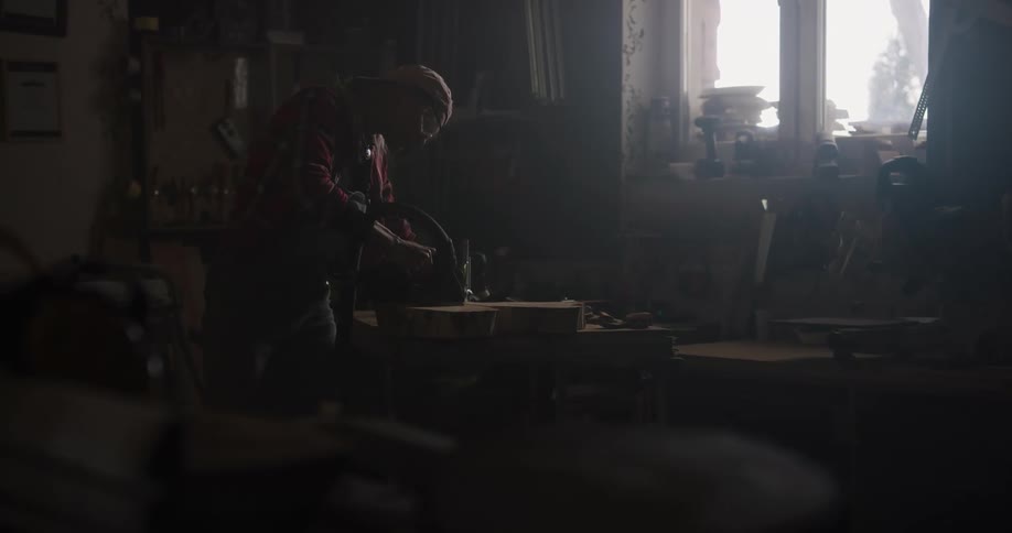 A man is using a machine in a warehouse setting