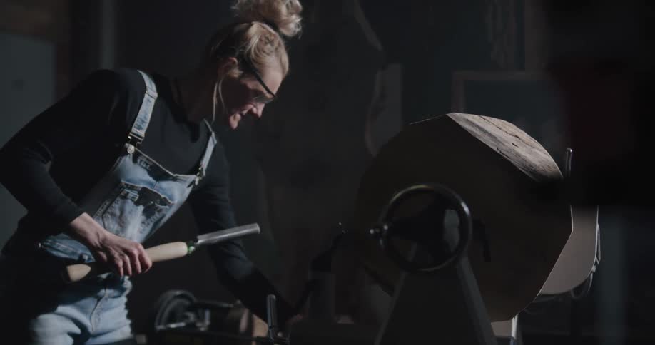 A woman is working in a workshop
