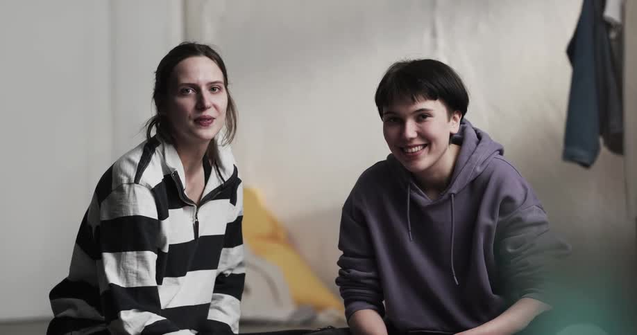 Two women that are talking to each other