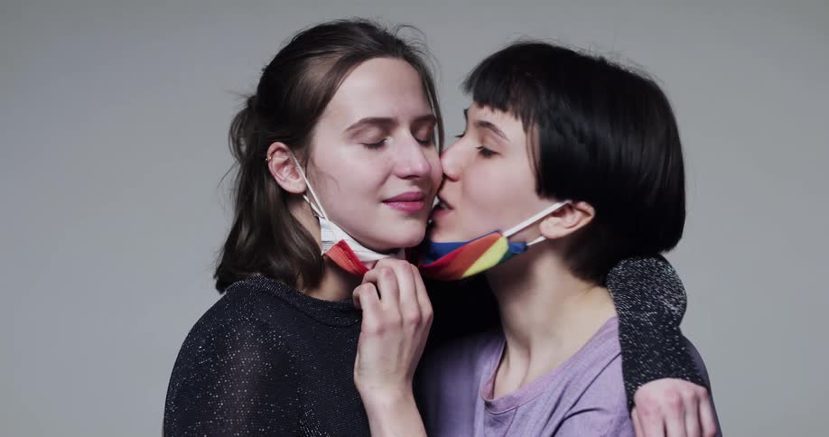 Two women kissing each other