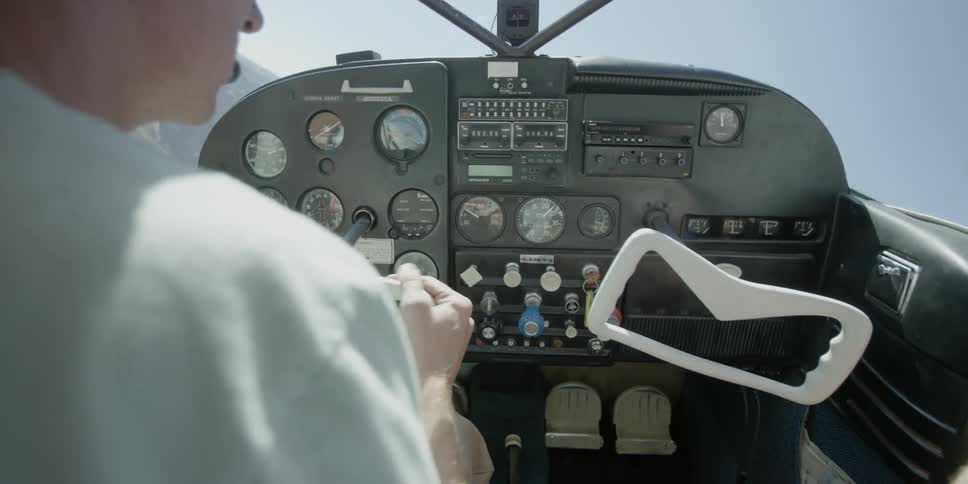 View of the cockpit as a pilot flies a small aircraft
