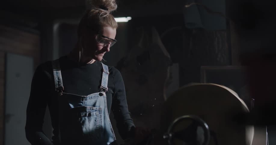A woman is working in a factory shop