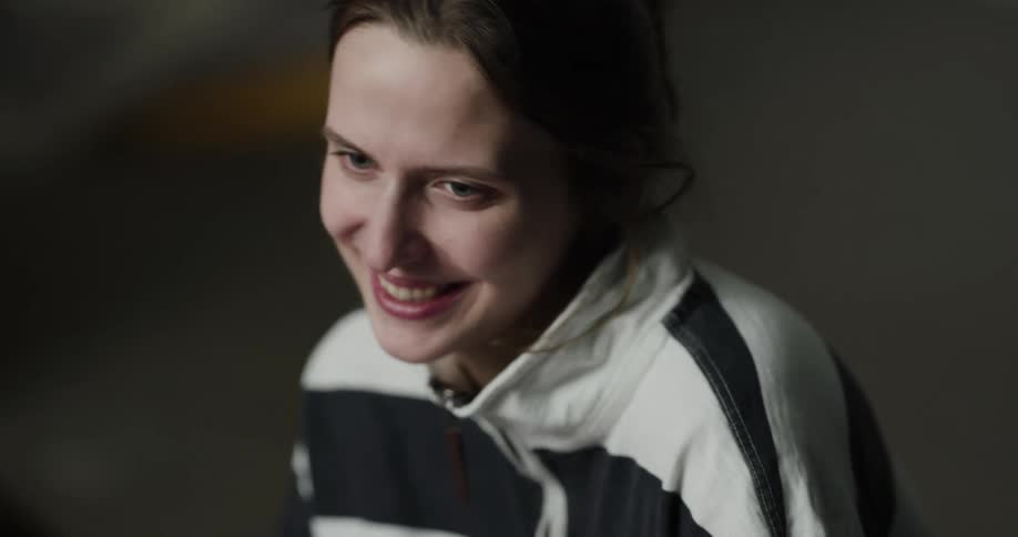 A teenage girls smiles and laughs