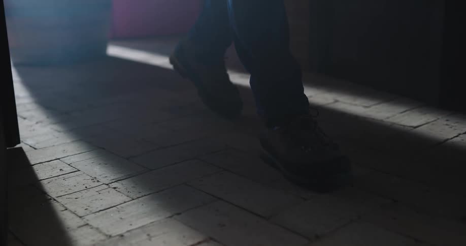 A door opens and a person walks through