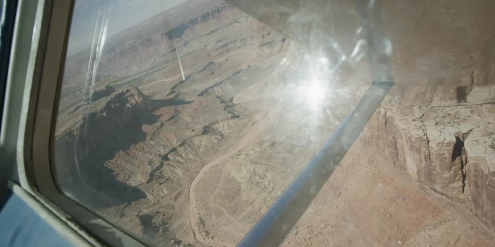 View out of a plane window as it turns