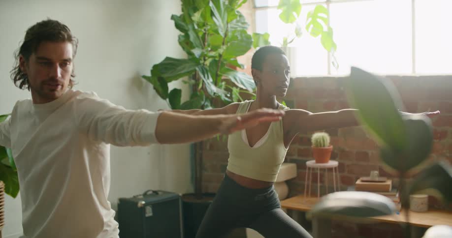 A man and woman doing yoga