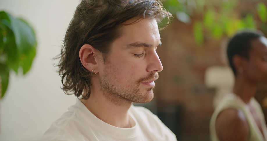A man and woman doing meditation and yoga