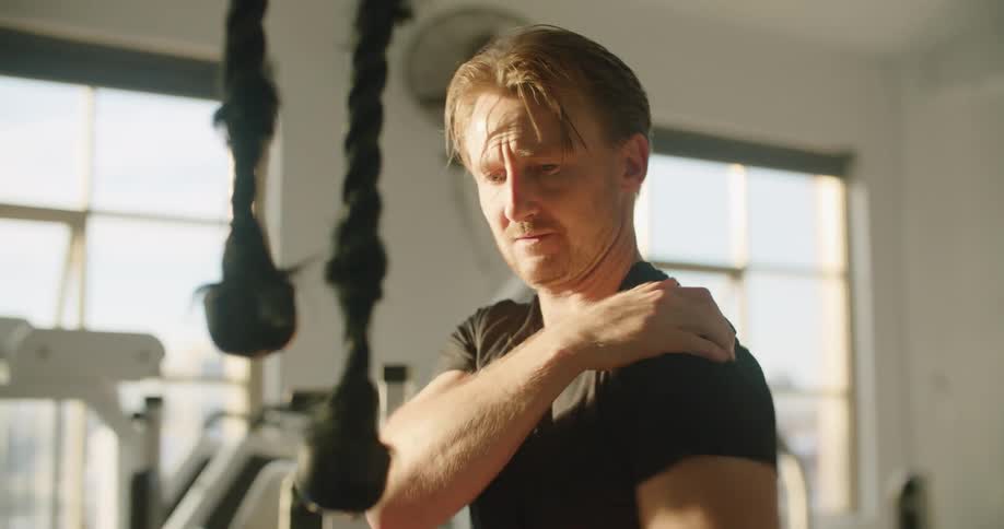 A man that is working out in a gym