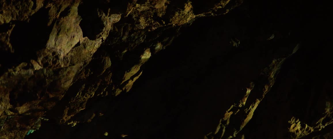Light shining over large rocks